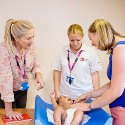 Health visitors, mum and baby at a family centre