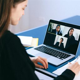 Woman on a video call with colleagues